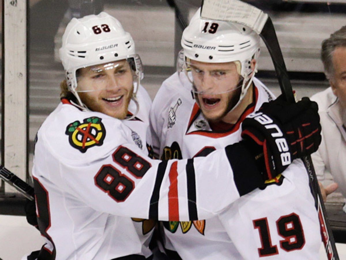 Reuniting Jonathan Toews (right) and Patrick Kane proved to be a spark for Chicago's offense in Game 4. (Charles Krupa/AP)