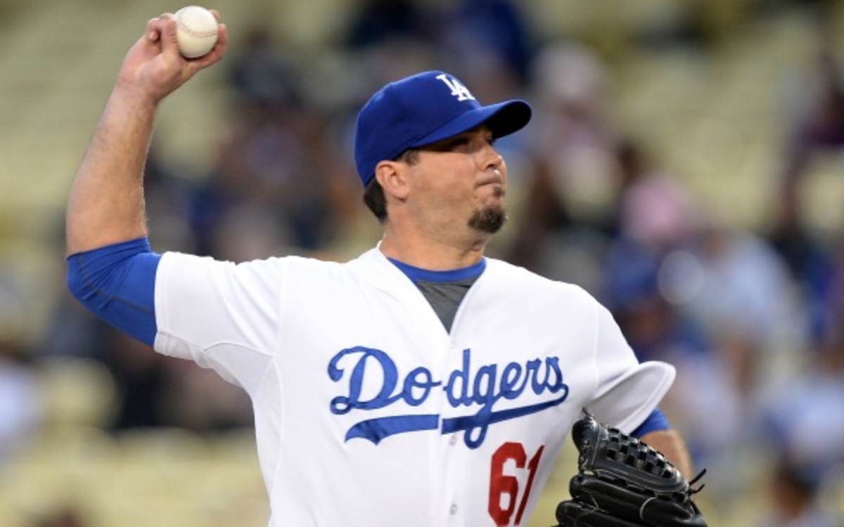 Dodgers pitcher Josh Beckett will not need surgery for a nerve issue in his hand. (Harry How/Getty Images)