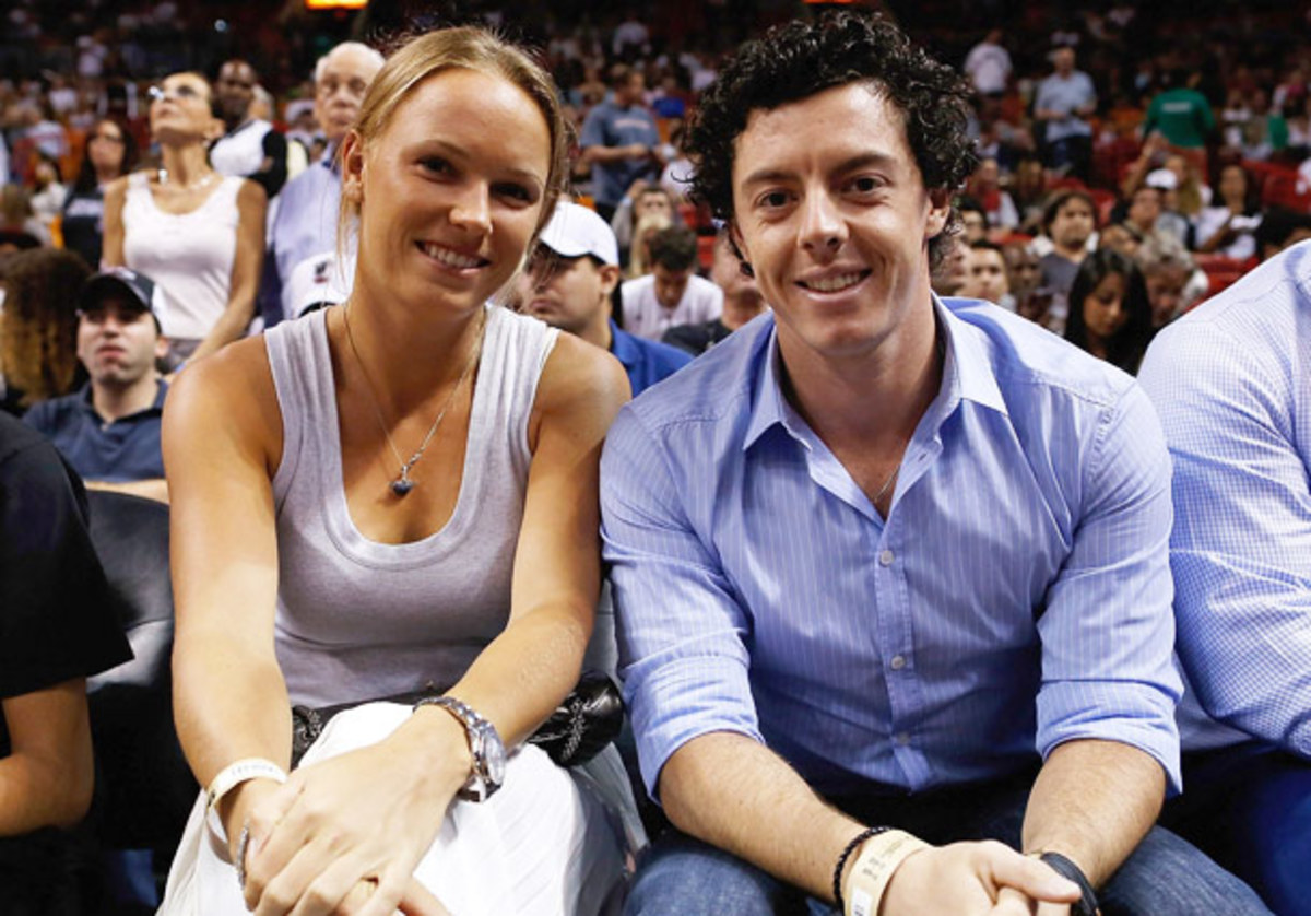 Caroline Wozniacki and boyfriend Rory McIlroy are always in the spotlight. (Getty Images)