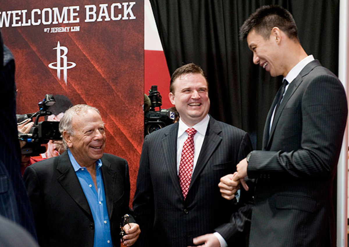 Rockets GM Daryl Morey (center) assembled the pieces necessary to attract Dwight Howard to Houston.