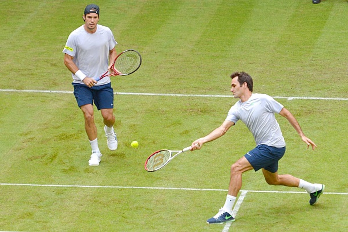 The world's number one tennis player Roger Federer returns the ball back  from Germany's Tommy Haas during the semi finals of the Men's Dubai Tennis  Championships on March 2, 2007. Federer won