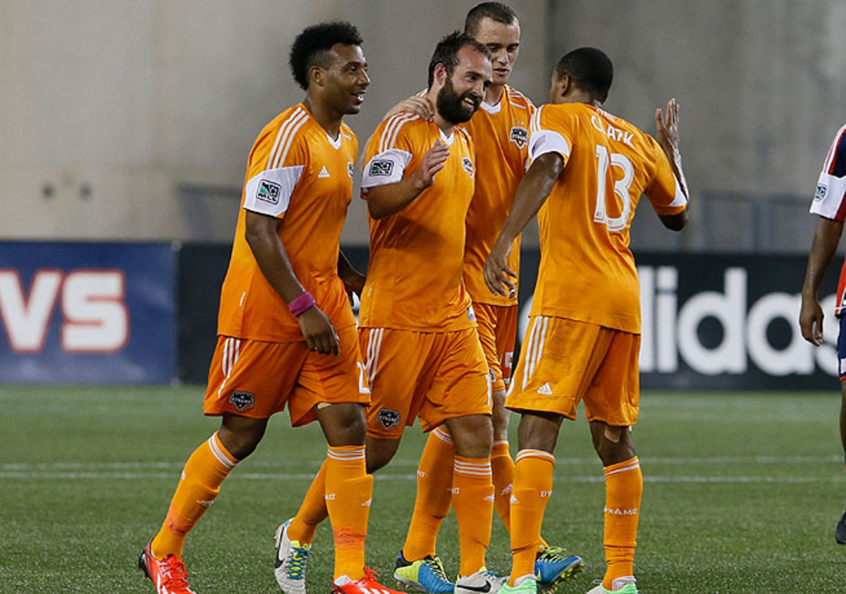 Adam Moffat's (center) thunderbolt for Houston against New England was the first of his two goals.