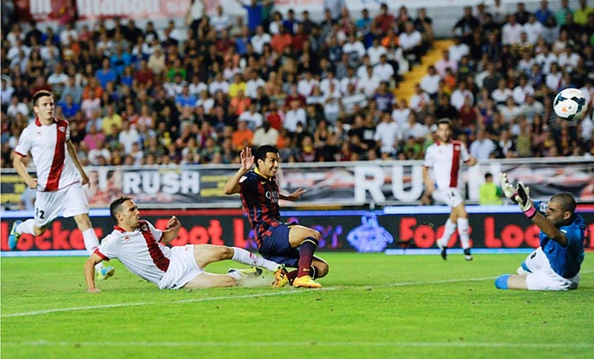 Pedro scored three goals as Barcelona rolled to a 4-0 win over Ray Vallecano.