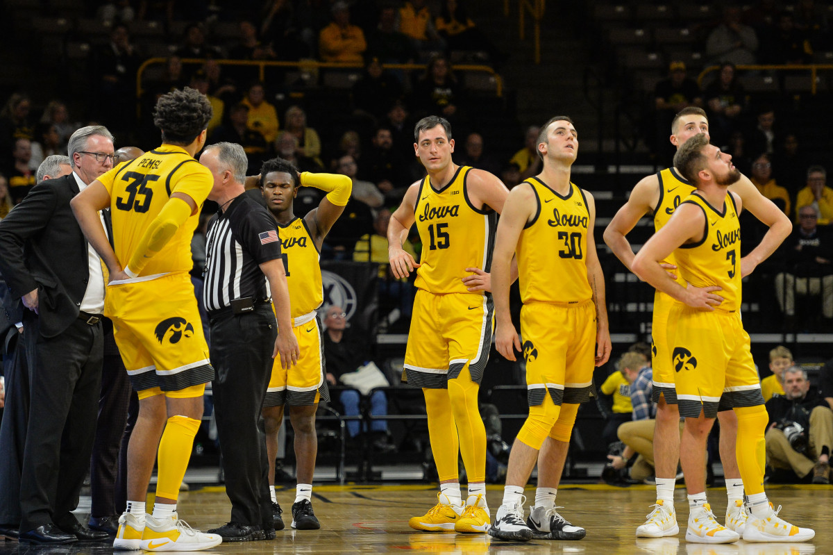 Iowa players and head coach Fran McCaffery react after a technical foul called during the second half against DePaul.