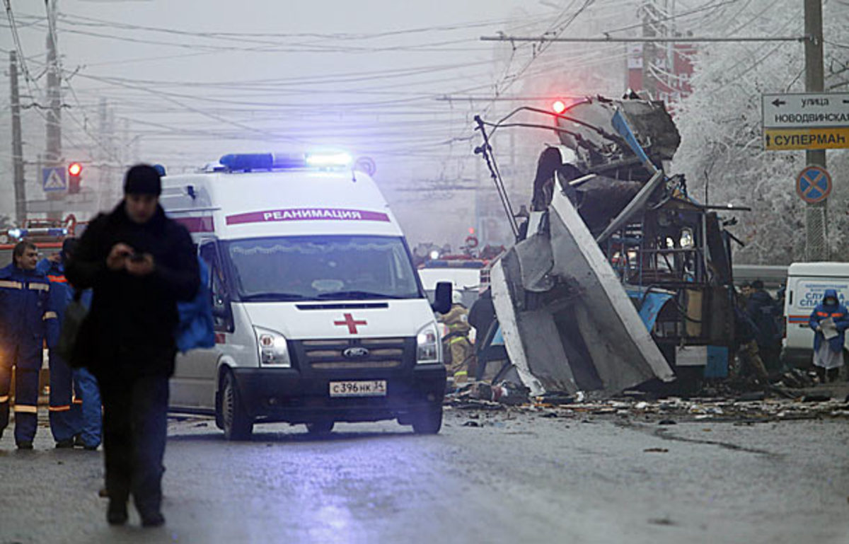 An ambulance leaves the site of a trolleybus explosion in Volgograd, Russia, Monday, Dec. 30, 2013. The explosion left 10 people dead Monday, a day after a suicide bombing that killed at least 17 at the city's main railway. The explosions put the city on edge and highlighted the terrorist threat that Russia is facing as it prepares to host the Winter Games in February. Volgograd is about 650 kilometers (400 miles) northeast of Sochi, where the Olympics are to be held. (AP Photo/Denis Tyrin)