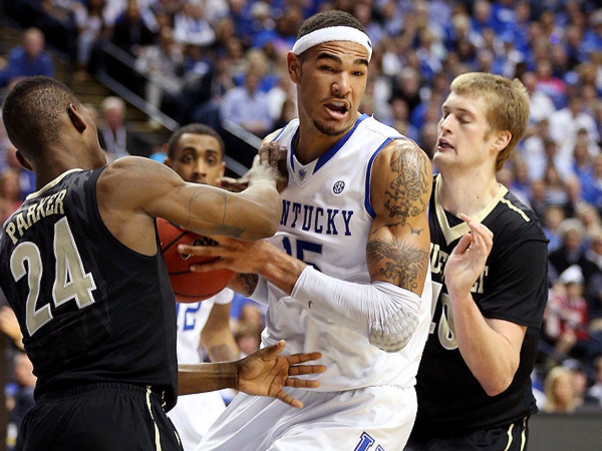 Willie Cauley-Stein and the Kentucky Wildcats will face North Carolina, Louisville and Michigan State next season. (Andy Lyons/Getty Images)