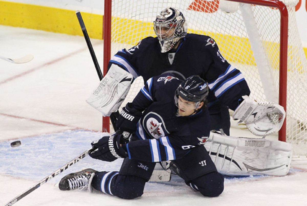 Ron Hainsey and Ondrej Pavelec of the Winnipeg Jets