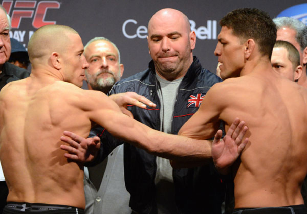 Things got testy during Nick Diaz and Georges St-Pierre's weigh-in for UFC 158. (Eric Bolte-USA TODAY Sports)