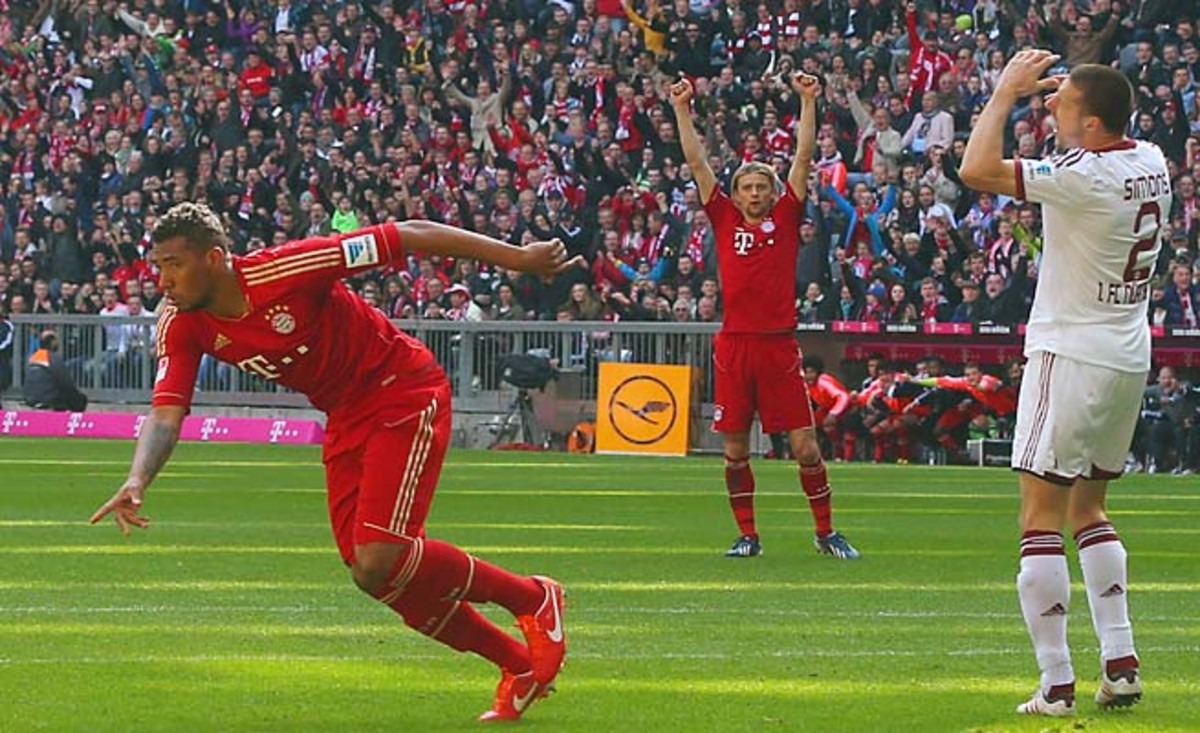 Bayern Munich's Jerome Boateng (left) celebrates one of his club's four goals on Saturday.
