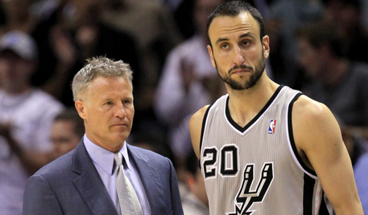 Brett Brown, pictured with Manu Ginobili, has emerged as a candidate to coach the Denver Nuggets. (Ronald Martinez/Getty Images) 