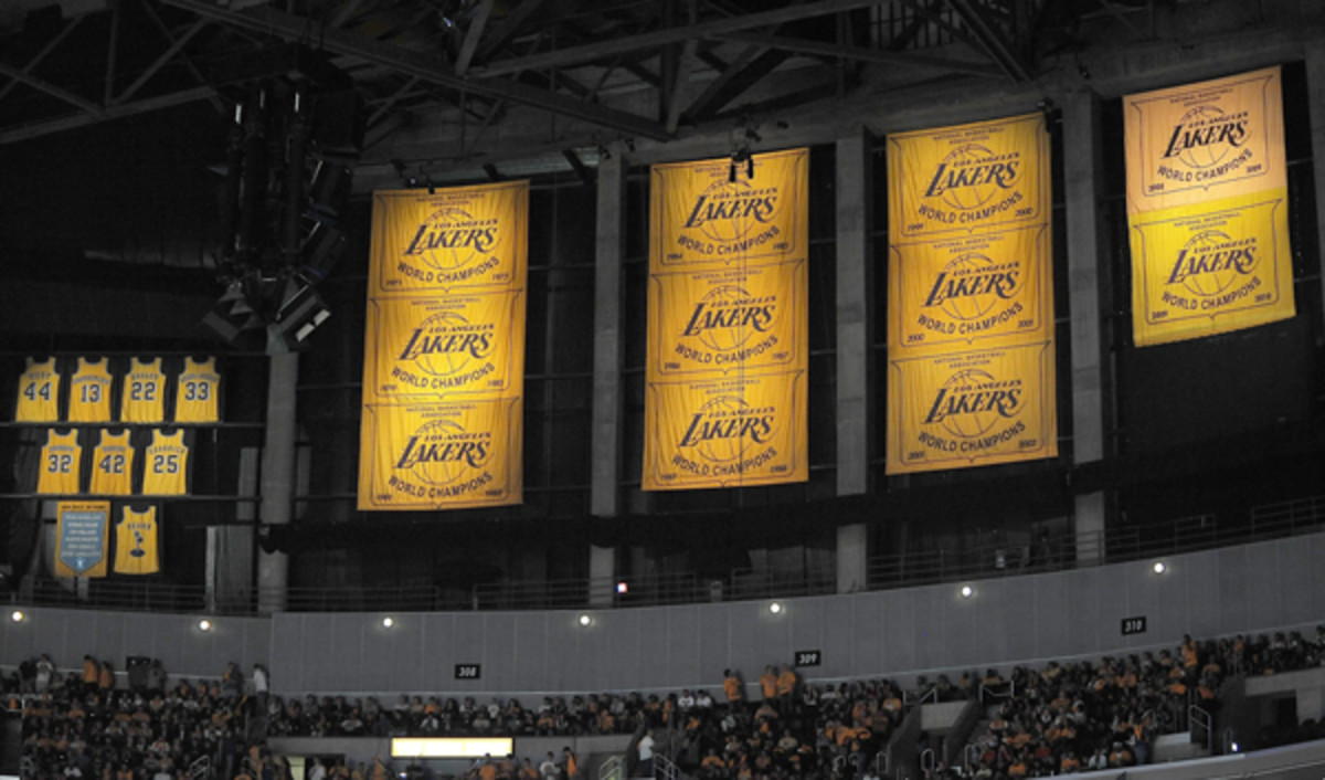 Doc Rivers covers up Lakers title banners with Clippers posters at Staples  Center - Sports Illustrated
