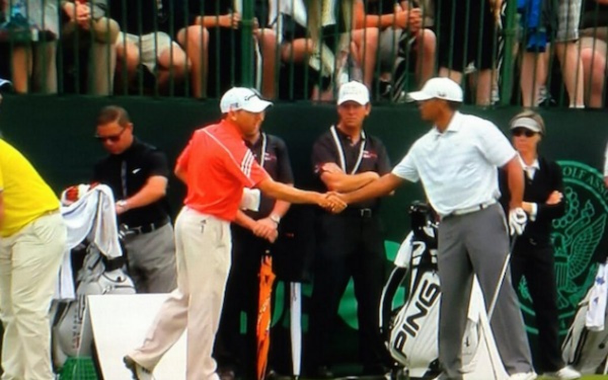 Tiger Woods and Sergio Garcia shake hands during practice for the U.S. Open. (Courtesy of the Golf Channel)