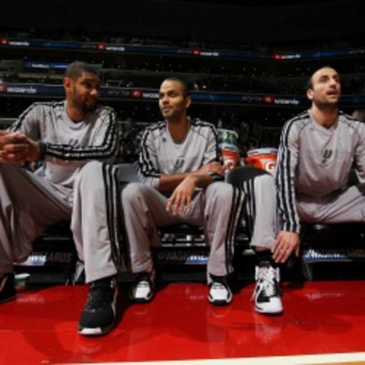 Spurs stars Tim Duncan, Tony Parker and Manu Ginobili sat out the team's Nov. 29 game against the Miami Heat, which one lawyer claims violated the state deceptive and fair trade practices law. (Ned Dishman/Getty Images)
