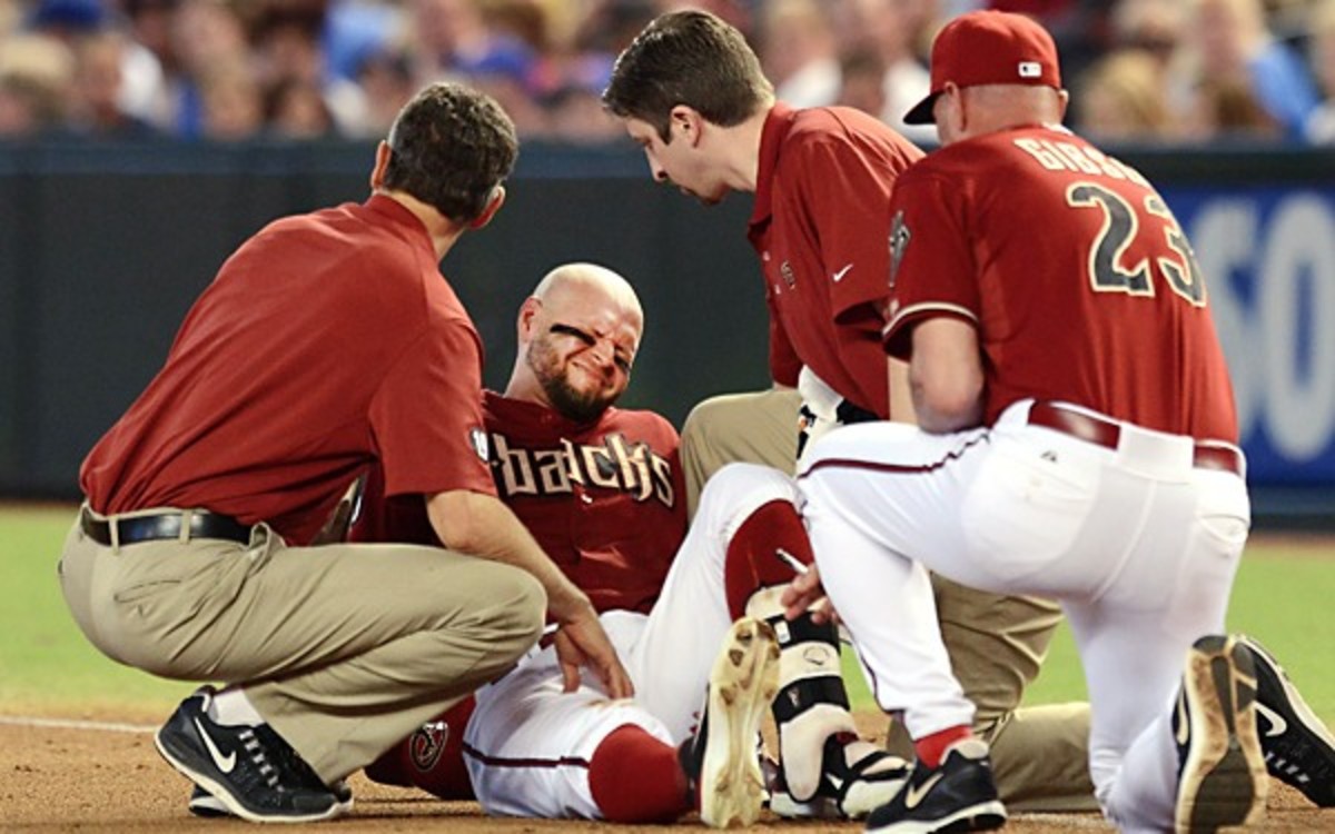 Diamondbacks OF Cody Ross suffered a dislocated right hip trying to beat a throw. (Norm Hall/Getty Images)