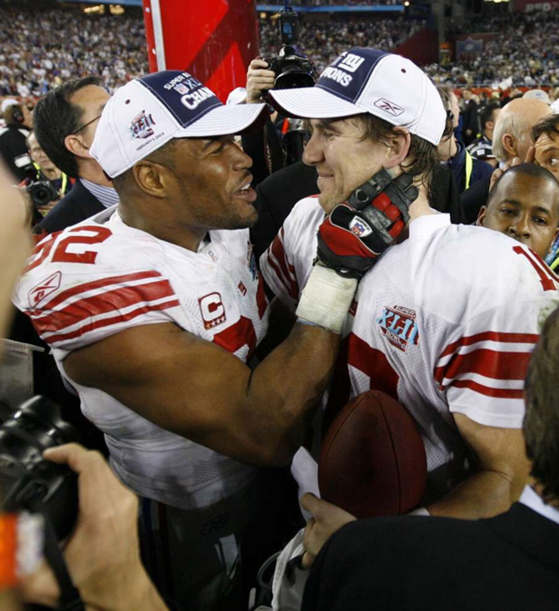  Michael Strahan and Eli Manning