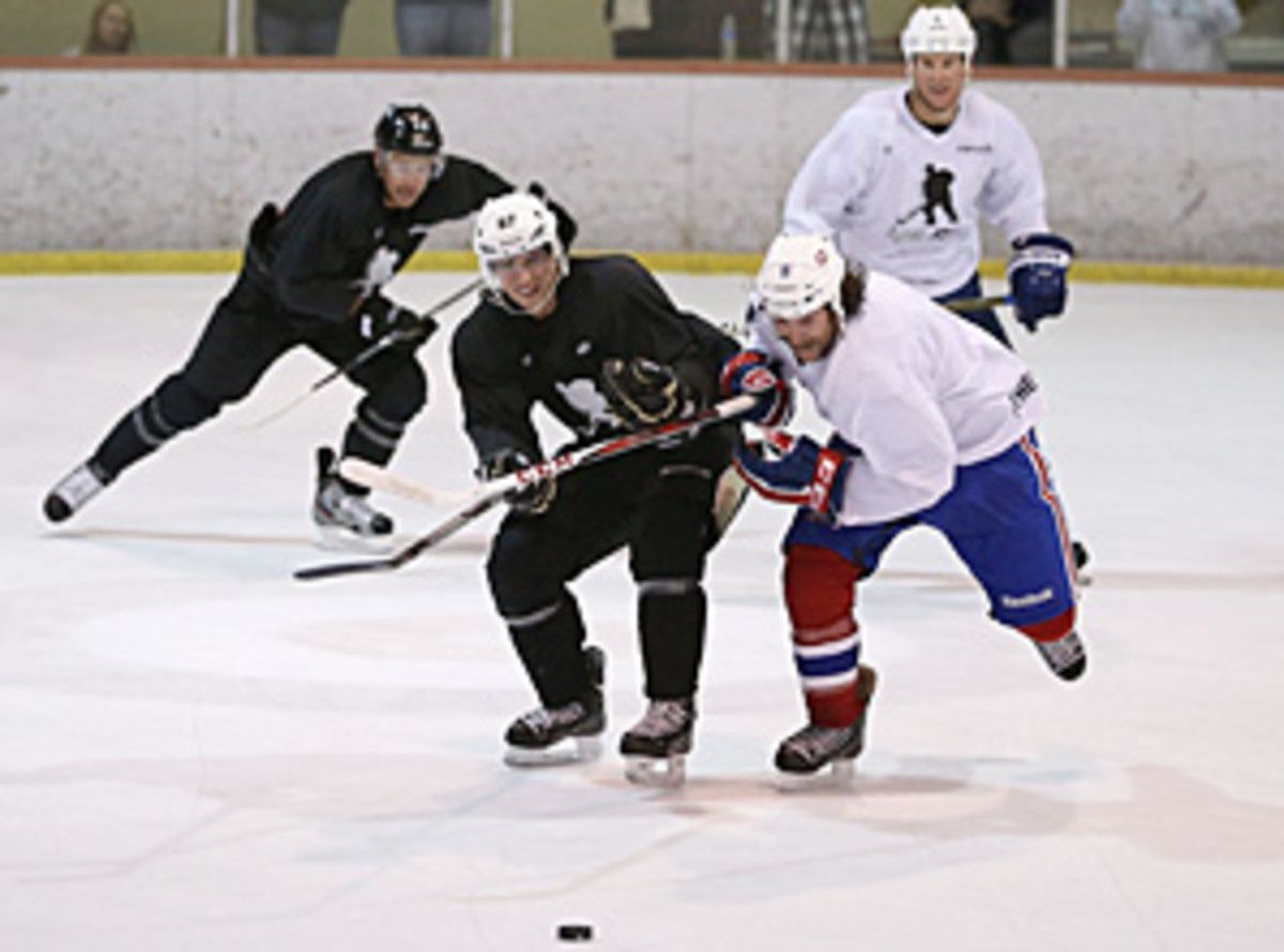 Sidney Crosby (left) has been trying to stay in playing shape while being involved in the CBA talks.
