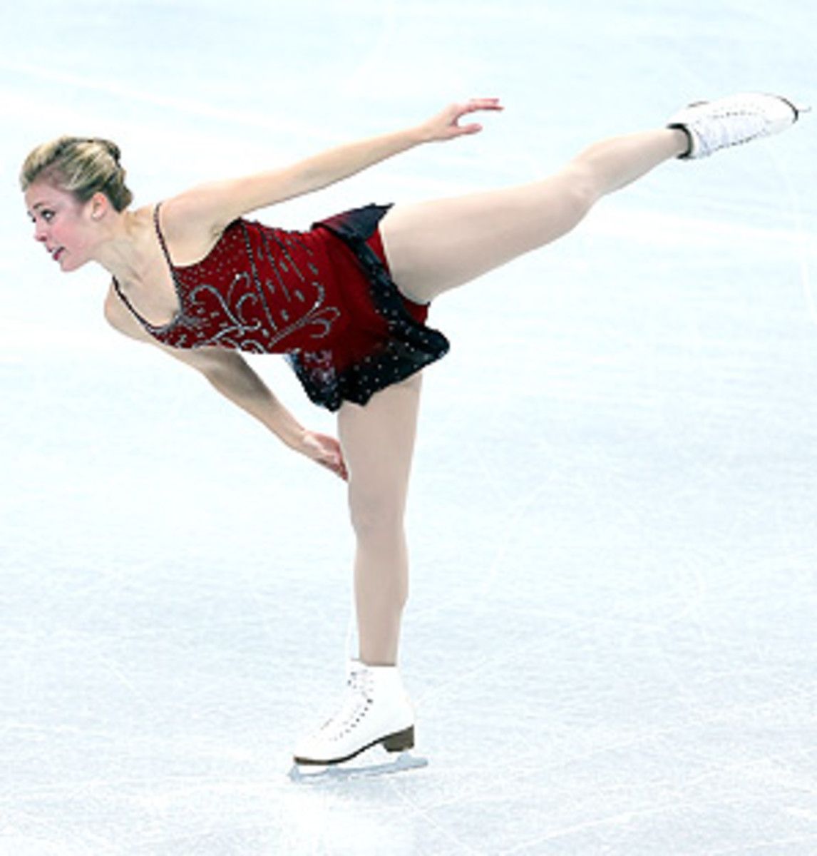 U.S. figure skater Ashley Wagner trails leader Mao Asada by half a point after the short program at the Grand Prix Final.