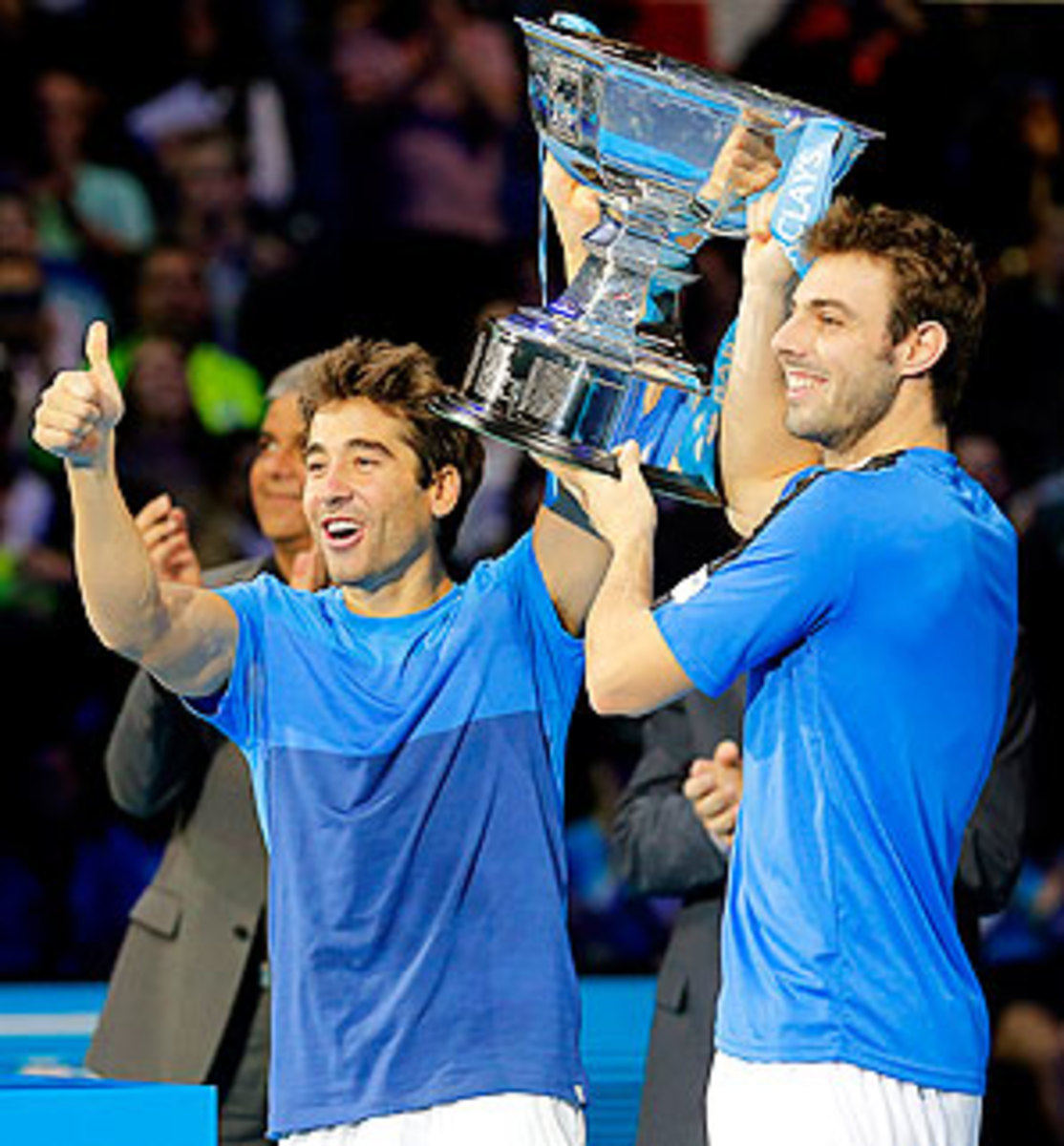 Marc Lopez (left) and Marcel Granollers celebrate their third title of the season.