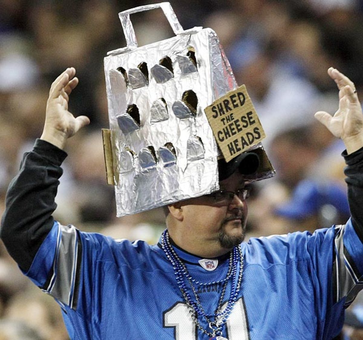Lions fan with grater hat is a threat to cheeseheads everywhere