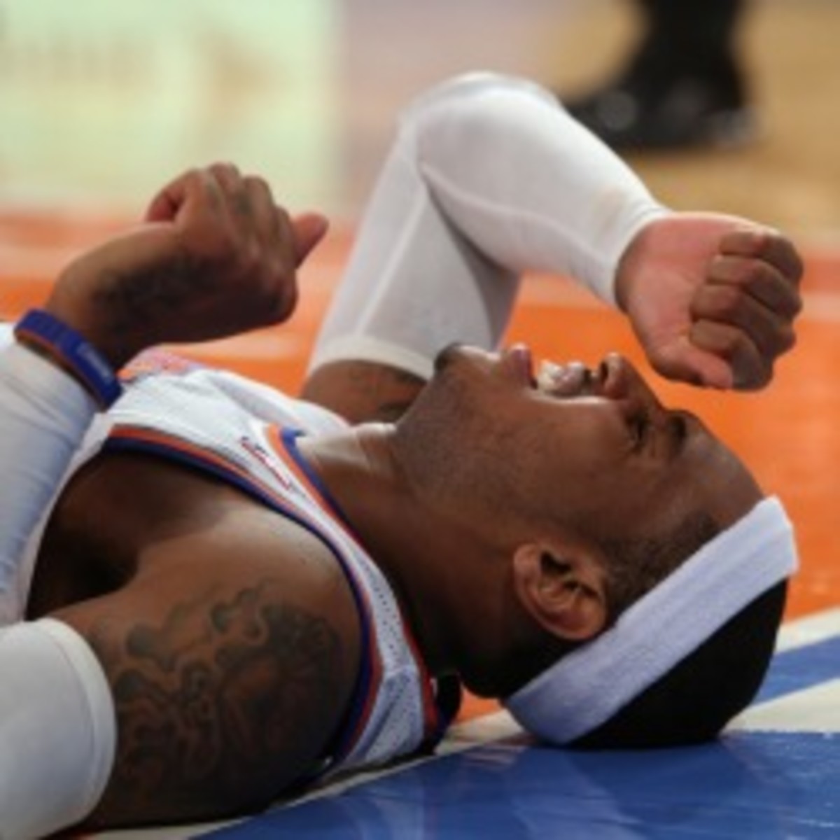 Knicks forward Carmelo Anthony will miss his second straight game with a sore ankle. (Bruce Bennett/Getty Images)