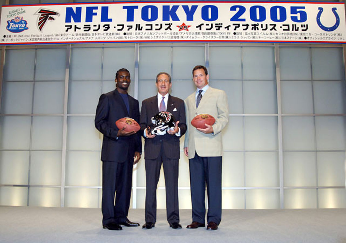  Michael Vick, Arthur Blank and Jim Mora 