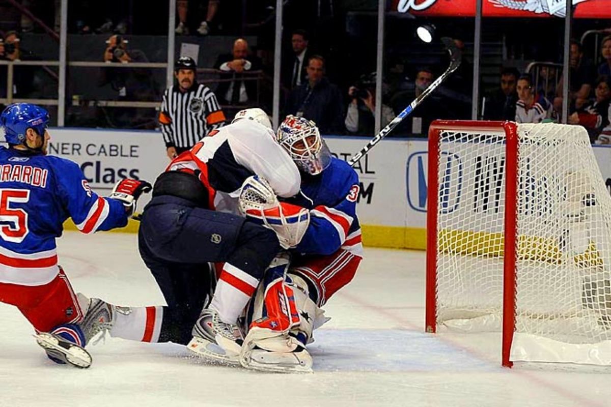 Viktor Kozlov scores and plows into Henrik Lundqvist