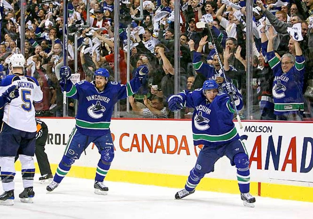 Daniel Sedin and Alexandre Burrows celebrate