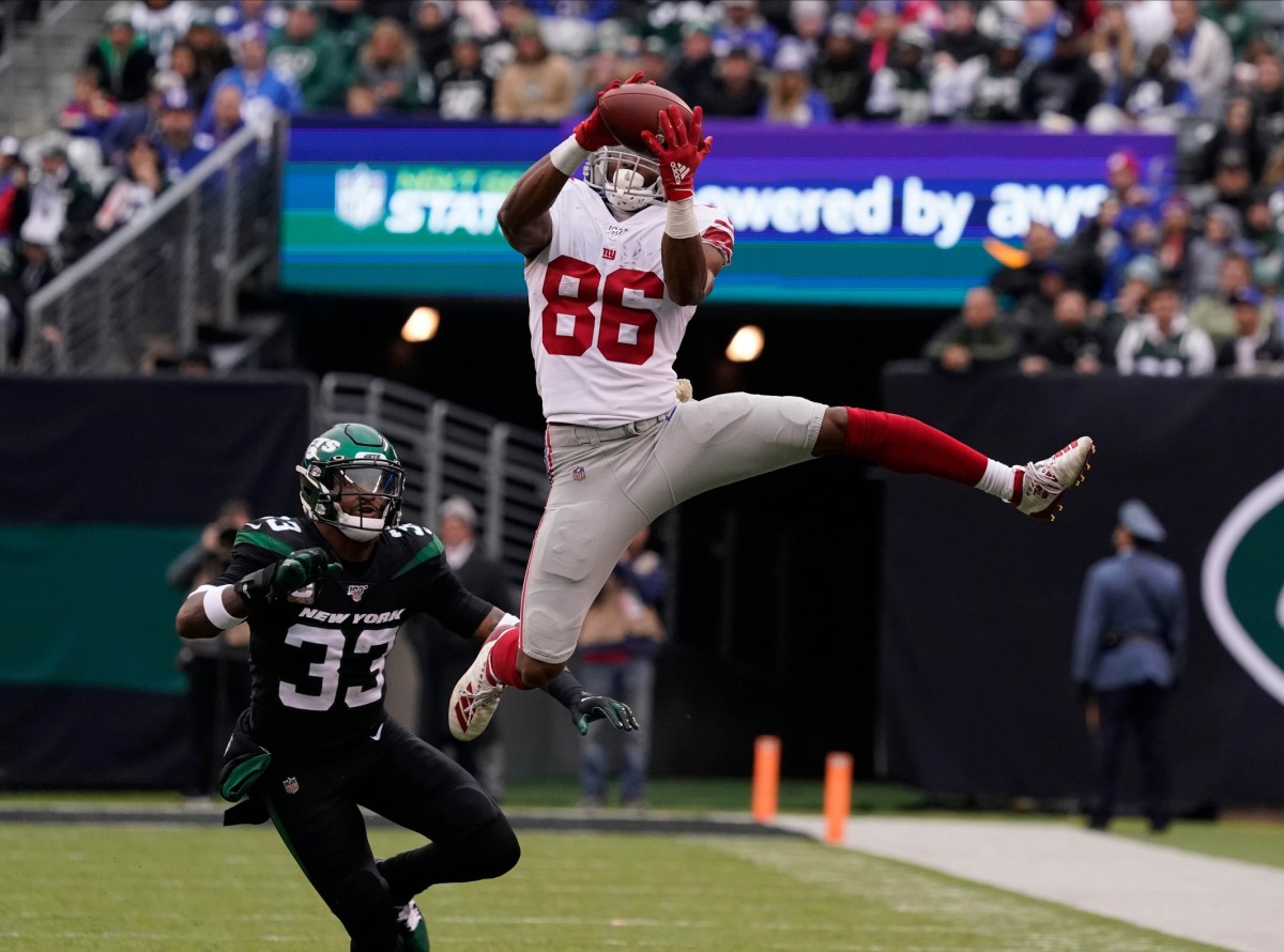 Nov 10, 2019; East Rutherford, NJ, USA; New York Giants wide receiver Darius Slayton (86) hauls in a reception in the 3rd quarter against the Jets as New York Jets strong safety Jamal Adams (33) defends at MetLife Stadium.