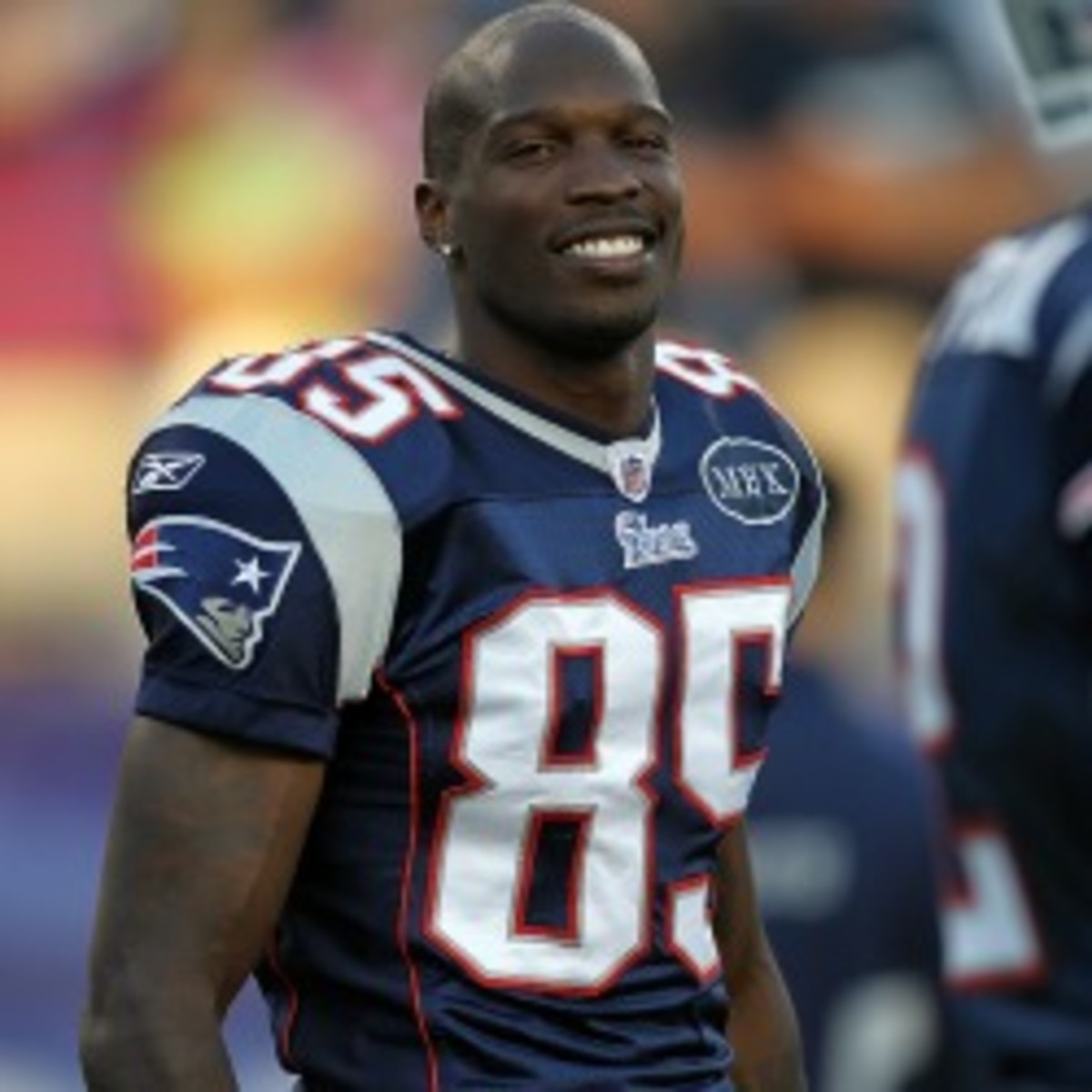 Chad Johnson, who last played for the Patriots in 2011, was cut by the Dolphins after being arrested in August. (Jim Rogash/Getty Images)