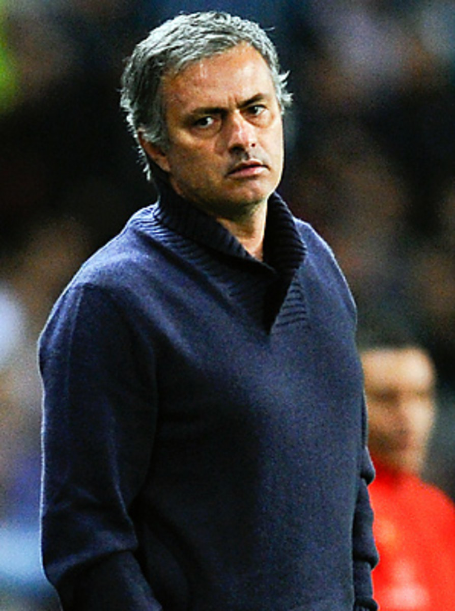 Jose Mourinho looks on during his team's 3-2 loss to Malaga.