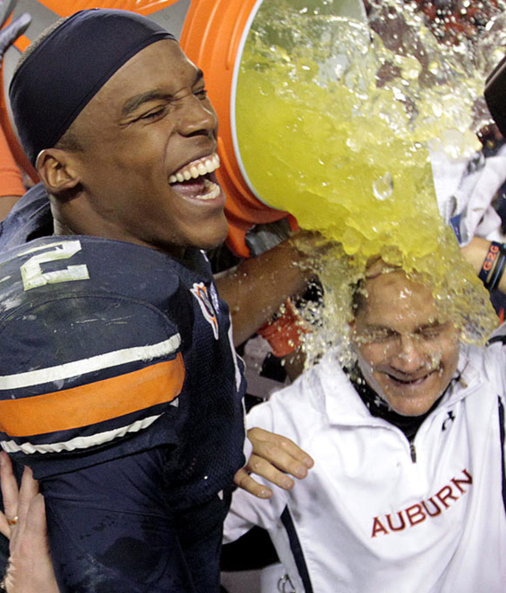 Cam Newton and Gene Chizik