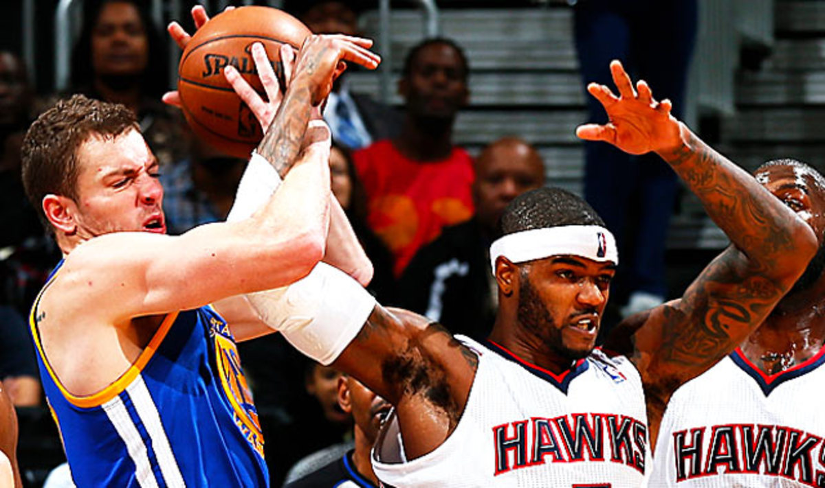 Lee (left) is fifth in the NBA with 11.5 rebounds per game. (Kevin C. Cox/Getty Images)