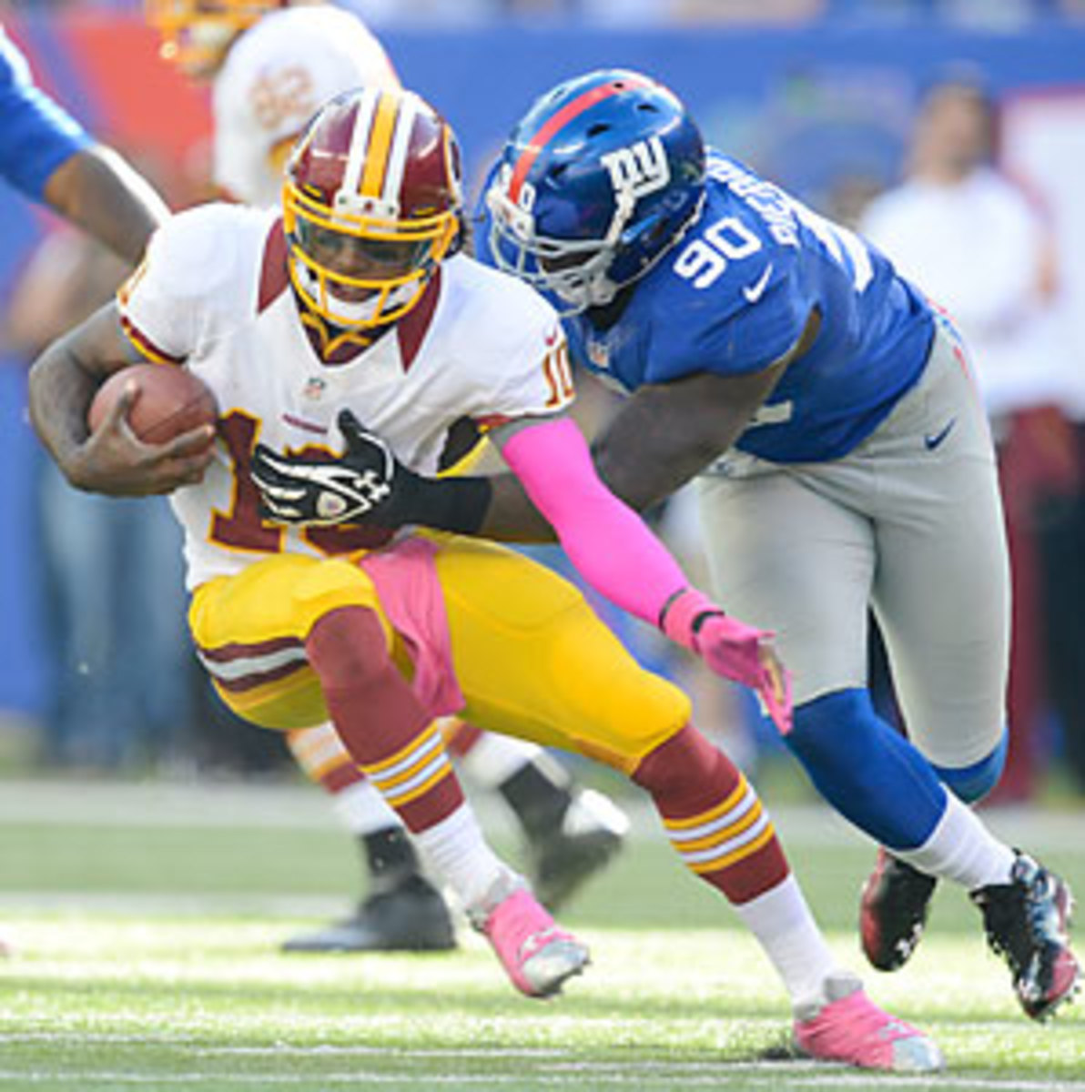 Robert Griffin III's ability to elude the Giants' defense Monday may hold the key to what team wins the NFC East. (Rich Kane/Icon SMI)