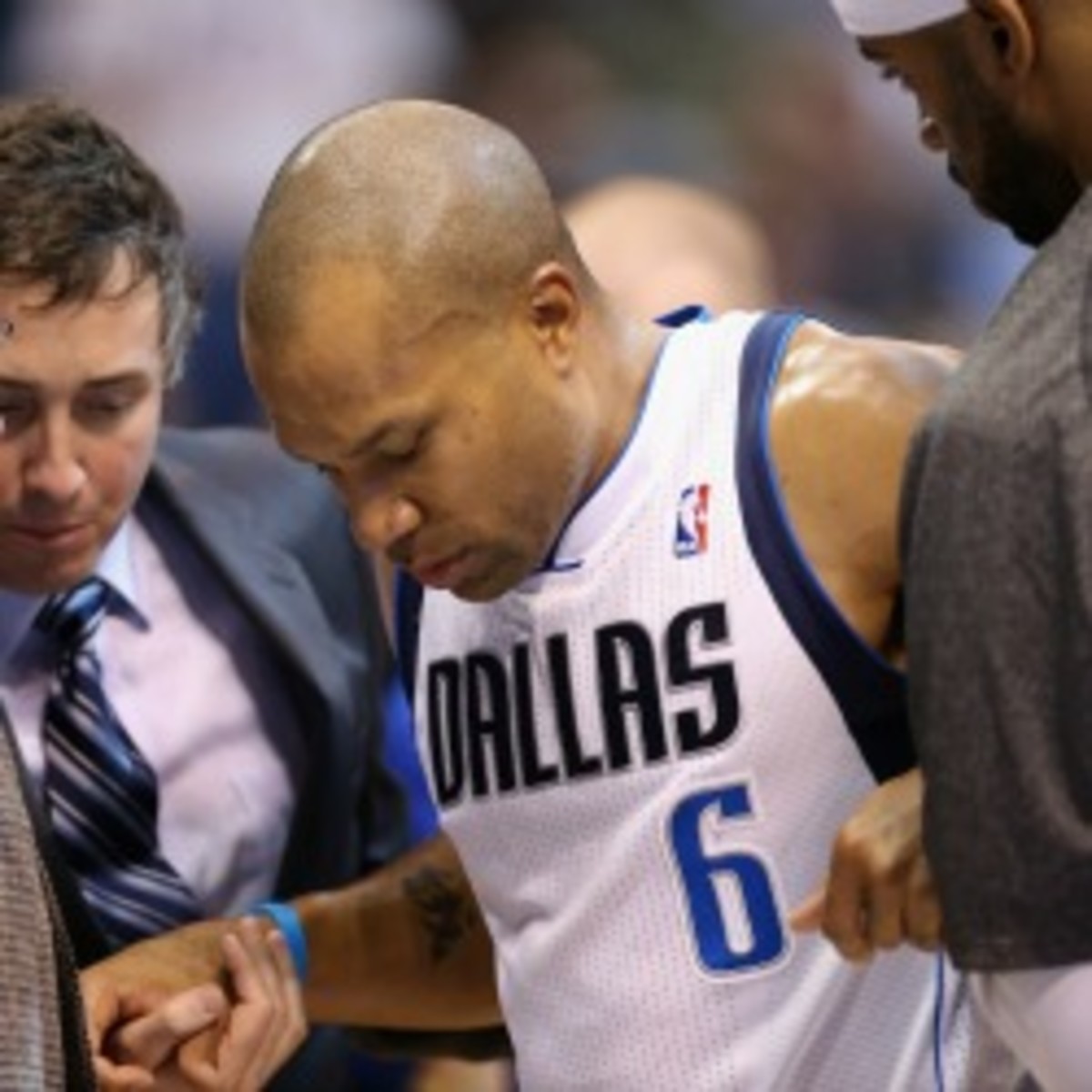 Injured guard Derek Fisher asked the Mavericks to release him so he could spend more time with his family. (Ronald Martinez/Getty Images)