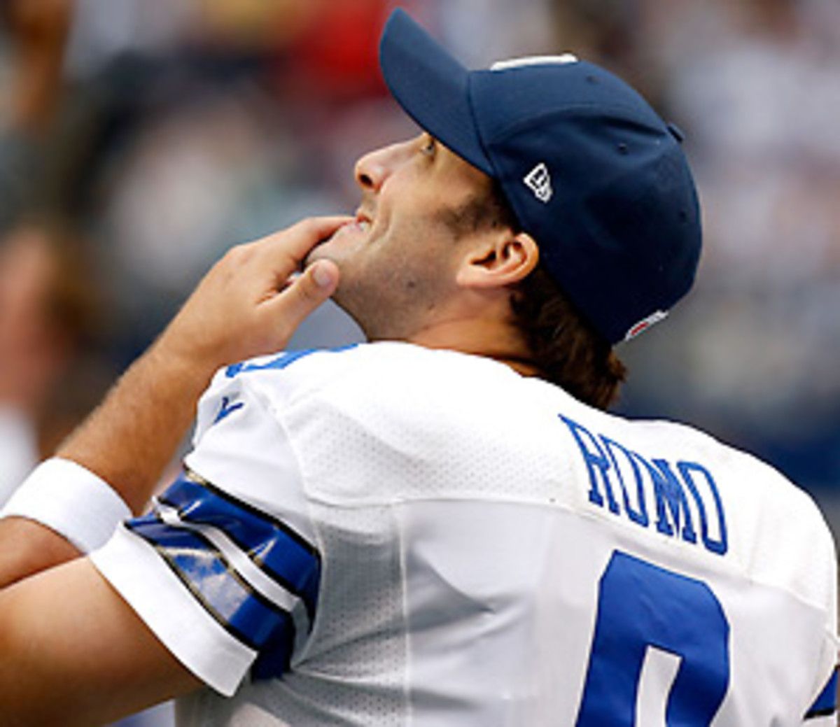 Tony Romo is 3-1 this December, but he'll need one more win for the Cowboys to make the playoffs. (Sharon Ellman/AP)