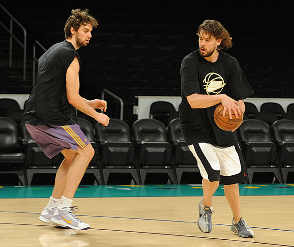 The Gasol brothers - Marc and Pau - play one-on-one. (Andrew D. Bernstein/Getty Images)