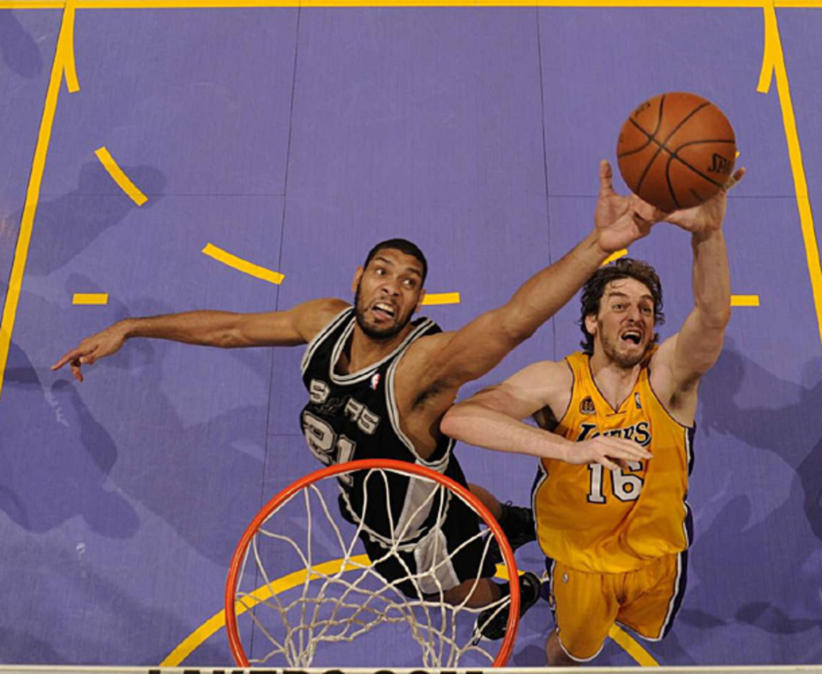 Gasol just avoids a block from Tim Duncan during a 2008 Lakers-Spurs game. (John W. McDonough/SI)