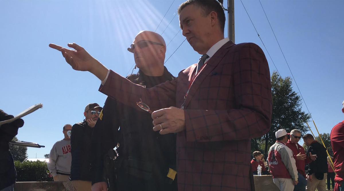 Alabama athletic director Greg Byrne speaks to a police officer ahead of Alabama's game against LSU. U.S. president Donald Trump's visit to Tuscaloosa went off without a hitch.