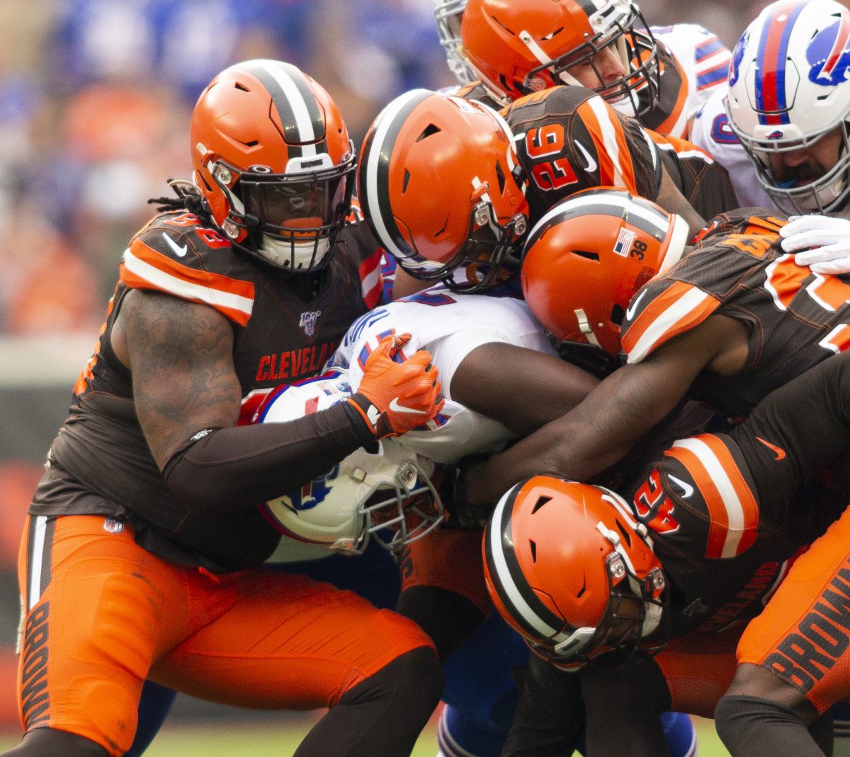 Nov 10, 2019; Cleveland, OH, USA; Buffalo Bills running back Devin Singletary (26) gets tackled by the Cleveland Browns defense during the second quarter at FirstEnergy Stadium. Mandatory Credit: Scott R. Galvin-USA TODAY Sports