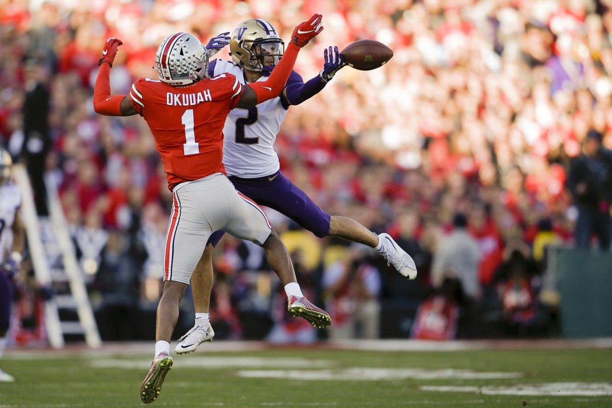 Ohio State Buckeyes cornerback Jeffrey Okudah (1) breaks up a pass for Washington Huskies wide receiver Aaron Fuller (2) in the 2019 Rose Bowl at Rose Bowl Stadium.