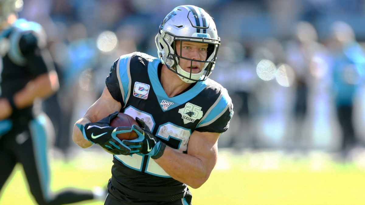 Nov 3, 2019; Charlotte, NC, USA; Carolina Panthers running back Christian McCaffrey (22) carries the ball for a touchdown in the second quarter against the Tennessee Titans at Bank of America Stadium. Mandatory Credit: Jeremy Brevard-USA TODAY Sports