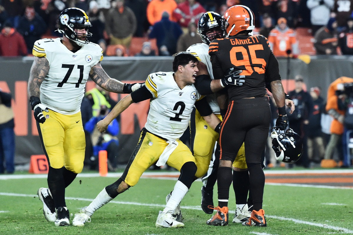 Nov 14, 2019; Cleveland, OH, USA; Pittsburgh Steelers quarterback Mason Rudolph (2) lunges back at Cleveland Browns defensive end Myles Garrett (95) after Garrett ripped his helmet off during the fourth quarter at FirstEnergy Stadium. Pittsburgh Steelers offensive tackle Matt Feiler (71) and offensive guard David DeCastro (66) try to restrain them. Mandatory Credit: Ken Blaze-USA TODAY Sports