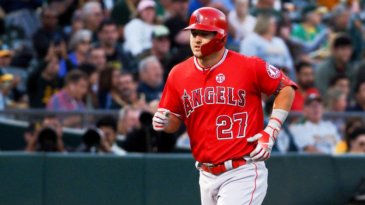 Sep 3, 2019; Oakland, CA, USA; Los Angeles Angels center fielder Mike Trout (27) rounds the bases on a solo home run against the Oakland Athletics during the first inning at Oakland Coliseum. Mandatory Credit: Kelley L Cox-USA TODAY Sports
