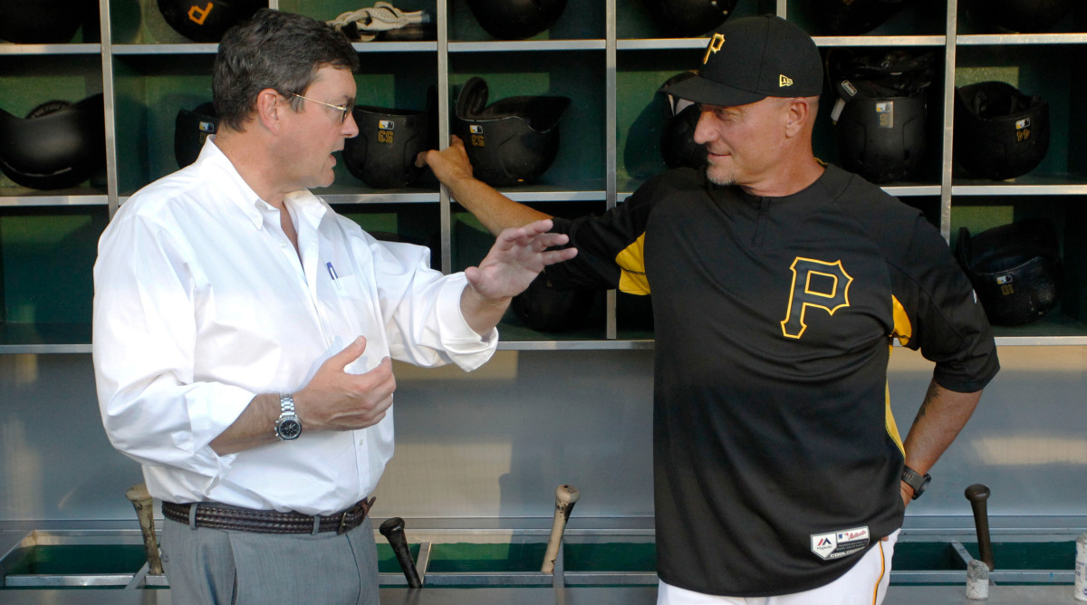 Sep 17, 2019; Pittsburgh, PA, USA;  Pittsburgh Pirates owner Robert Nutting (left) speaks with special assistant Jeff Banister (right) in the dugout before the game against the Seattle Mariners at PNC Park. Mandatory Credit: Charles LeClaire-USA TODAY Sports