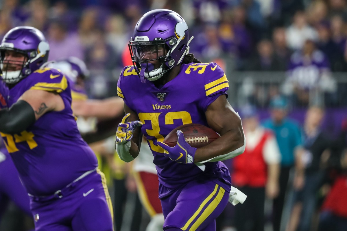 Minnesota Vikings running back Dalvin Cook (33) carries the ball during the second quarter against the Washington Redskins at U.S. Bank Stadium.