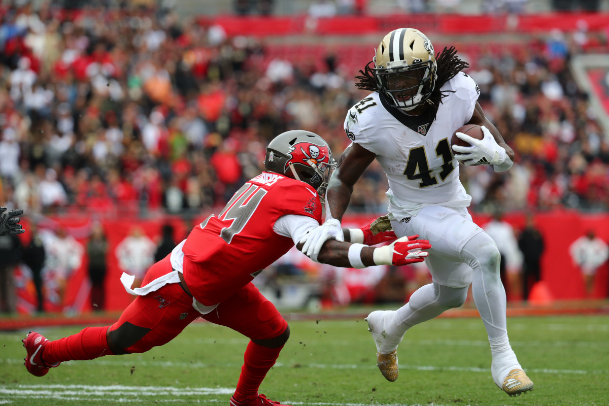 Nov 17, 2019; Tampa, FL, USA; New Orleans Saints running back Alvin Kamara (41) runs the ball against Tampa Bay Buccaneers safety Mike Edwards (34) during the first quarter at Raymond James Stadium. Mandatory Credit: Kim Klement-USA TODAY Sports