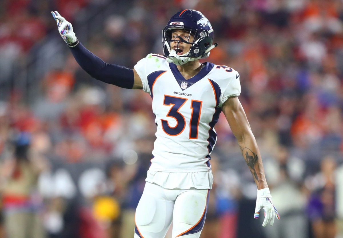 Denver Broncos safety Justin Simmons (31) reacts against the Arizona Cardinals at State Farm Stadium.