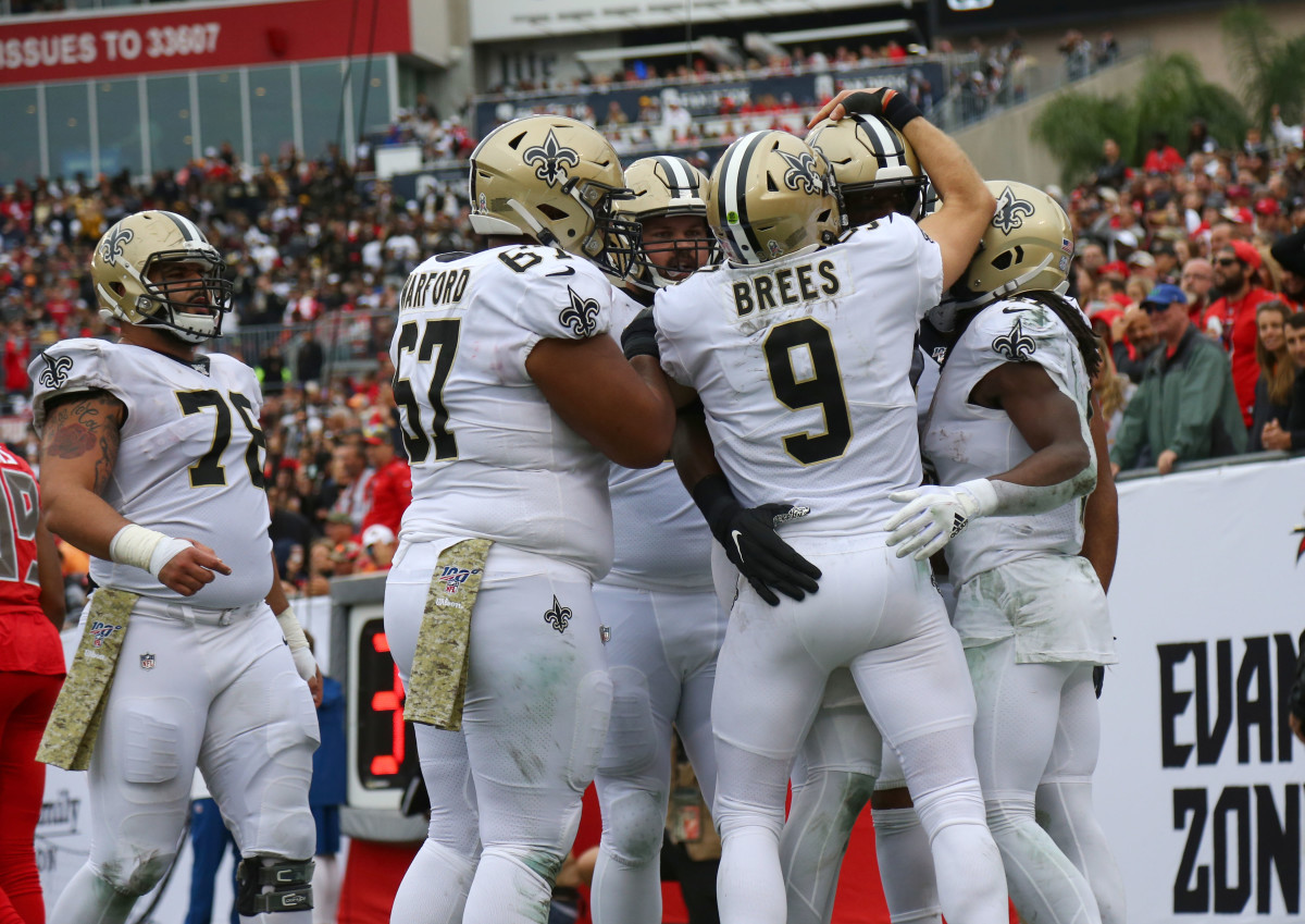 Nov 17, 2019; Tampa, FL, USA; New Orleans Saints tight end Jared Cook (87) is congratulated by quarterback Drew Brees (9) after scoring a touchdown against the Tampa Bay Buccaneers during the first half at Raymond James Stadium. Mandatory Credit: Kim Klement-USA TODAY Sports