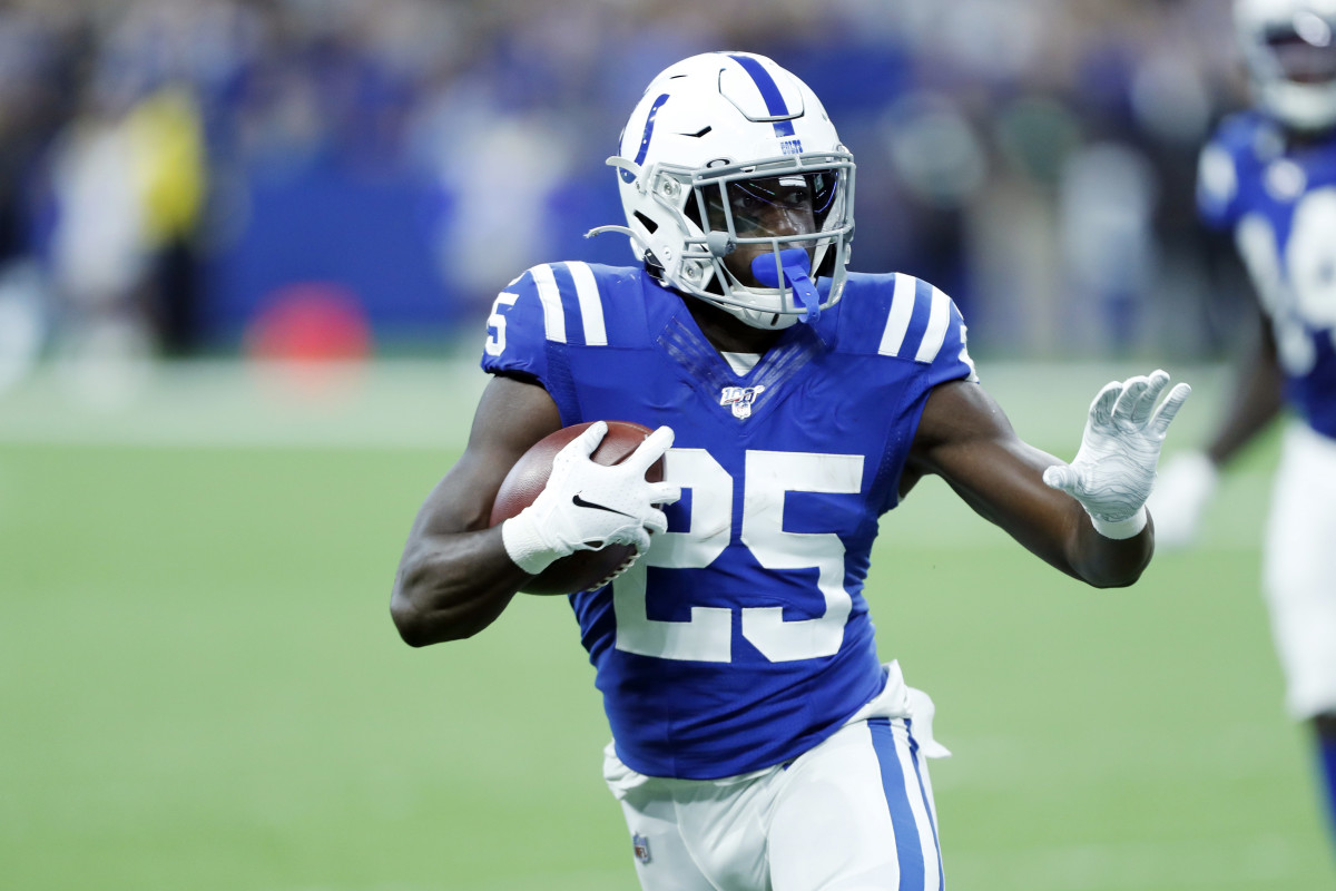 Indianapolis Colts running back Marlon Mack looks to stiff arm a tackler in a home game against Oakland earlier this season.