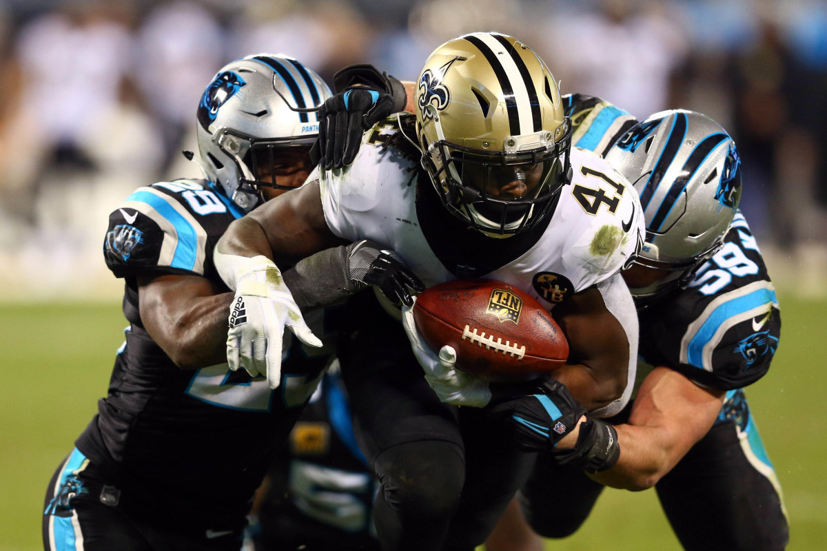 Dec 17, 2018; Charlotte, NC, USA; New Orleans Saints running back Alvin Kamara (41) gets tackled by Carolina Panthers middle linebacker Luke Kuechly (59) and free safety Mike Adams (29) during the fourth quarter at Bank of America Stadium. Mandatory Credit: Jeremy Brevard-USA TODAY Sports